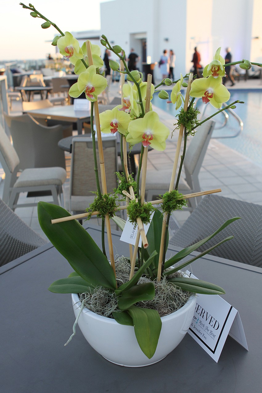 Flowers rested on the rooftop's tables.