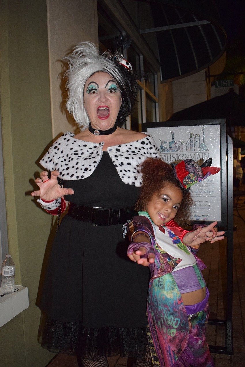 Lakewood Ranch's Carrie McQueen dresses as Cruella de Vil, and her daughter, Jaden, 6, dresses as Celia Facilier. McQueen has been dressing as Disney evil queens — such as Ursula, the Queen of Hearts and Maleficent — for years.