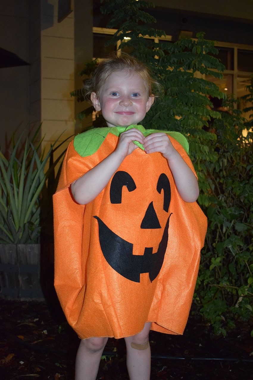 Parrish resident Avery Hull, 3, enjoys Boo Fest dressed as a pumpkin.