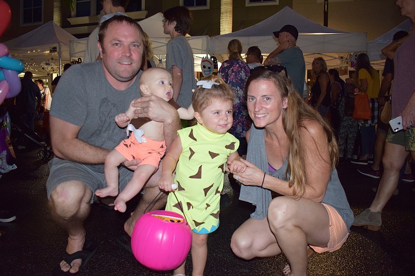 Sarasota residents Kris and Kristen Bowman have their kids, Owen, 6 months, and Laney, 2, dressed as Bam Bam and Pebbles from 