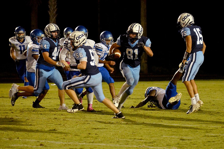 ODA senior running back Colin Castro (81) bursts through a hole.