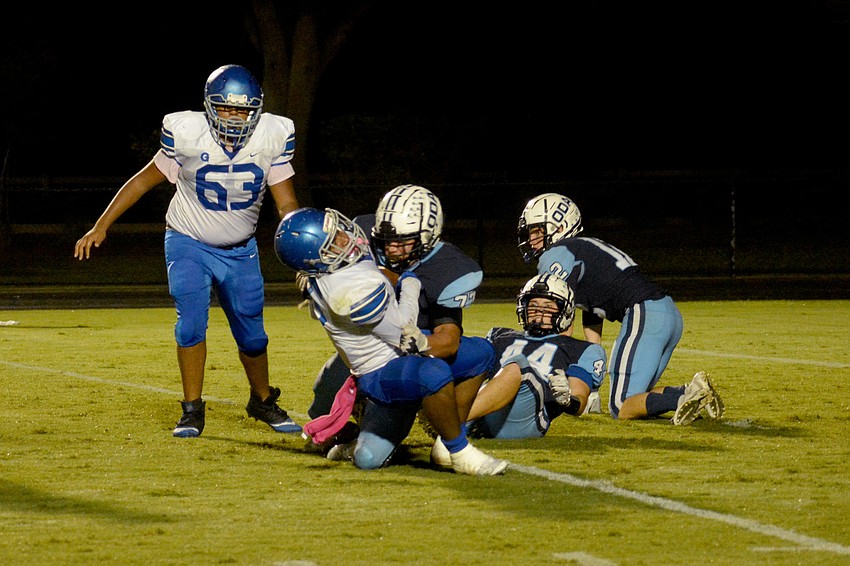 ODA senior defensive tackle Sebastian Frias-Imbert stuffs a Gateway Charter runner.