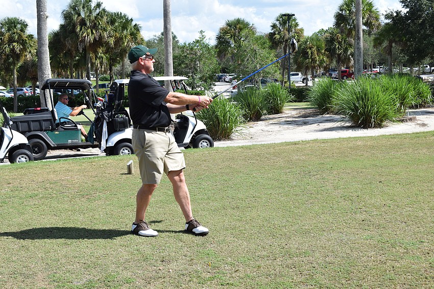 Tampa's Andy Westfall watches his shot during the Play for Pink tourney.