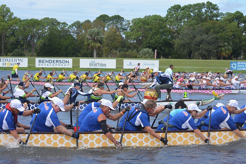 The NBP Dragons 200m premier/senior mixed 20 team (2) battles for position in a crowded field.