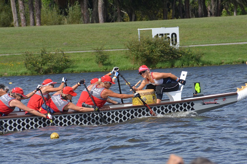 The Vogue Dragons paddle to the beat of a drum in the 500m senior women 10 event. The team finished first in its qualifying heat (2:45.35).
