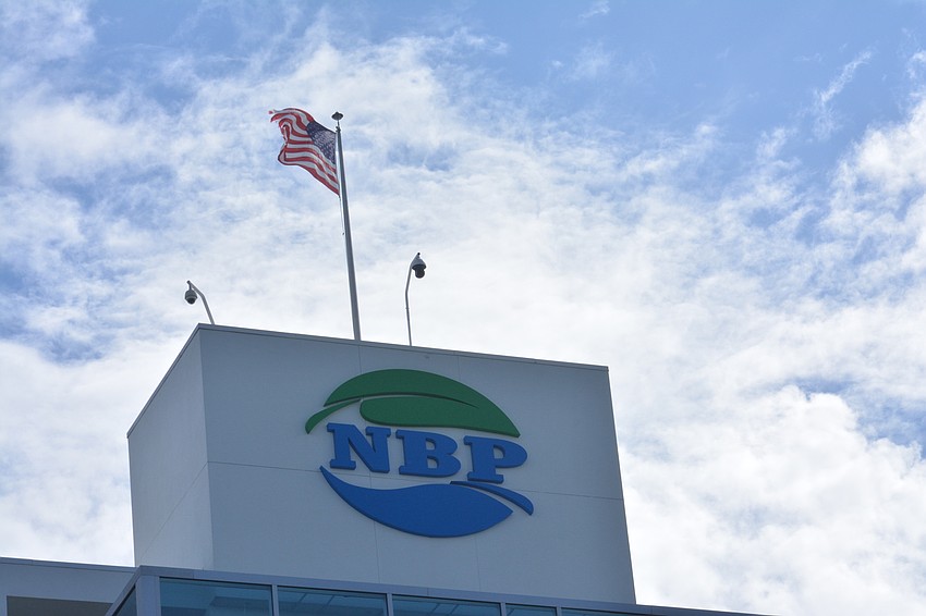 The wind, here blowing the American flag on top of the NBP finish tower, was whipping and causing choppy waters during the festival.