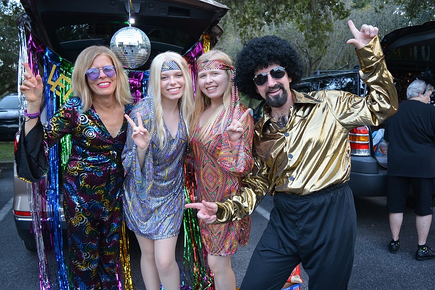 Kim, Erika, Isabelle and Brian Schmidt always dress as a theme. This year, they had disco music playing.