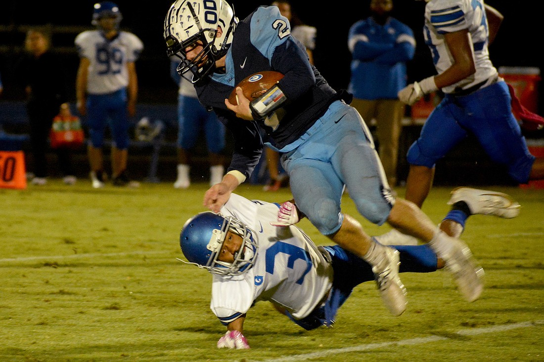 ODA senior running back Jarred Flahive flies in the air after a collision.