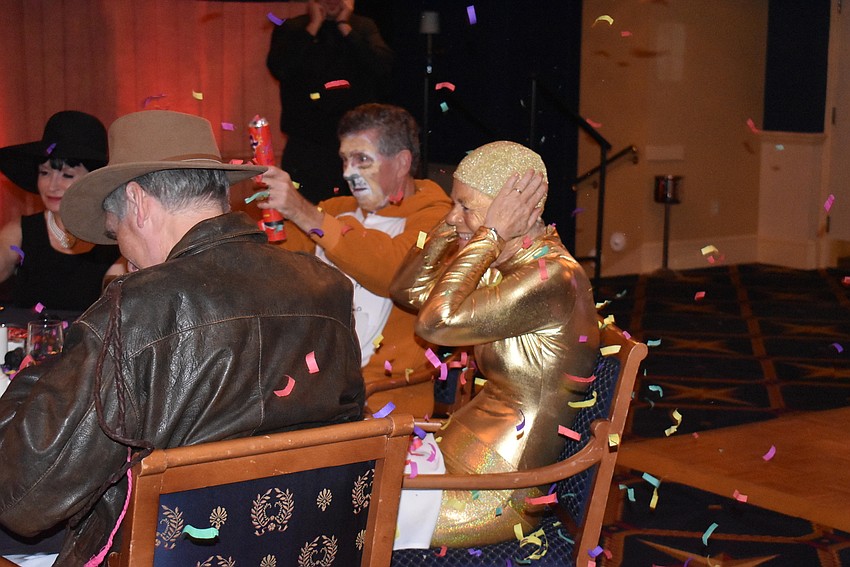 Helen Turner covers her ears from the pop.