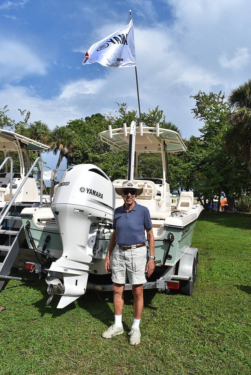 Don Nardone stands with a boat.