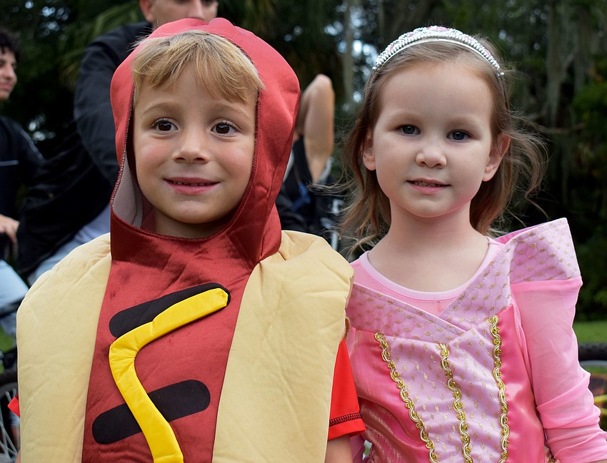 Zeke Folgia, 4, and Ruby Walke, 4, get ready to trick-or-treat around the trail.