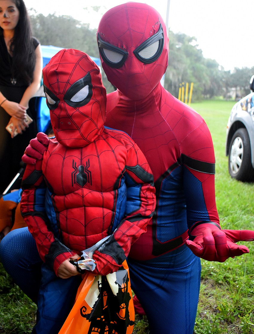 Great minds think alike as Santiago Tapia, 4, and Chris Knoll both dress as Spiderman.