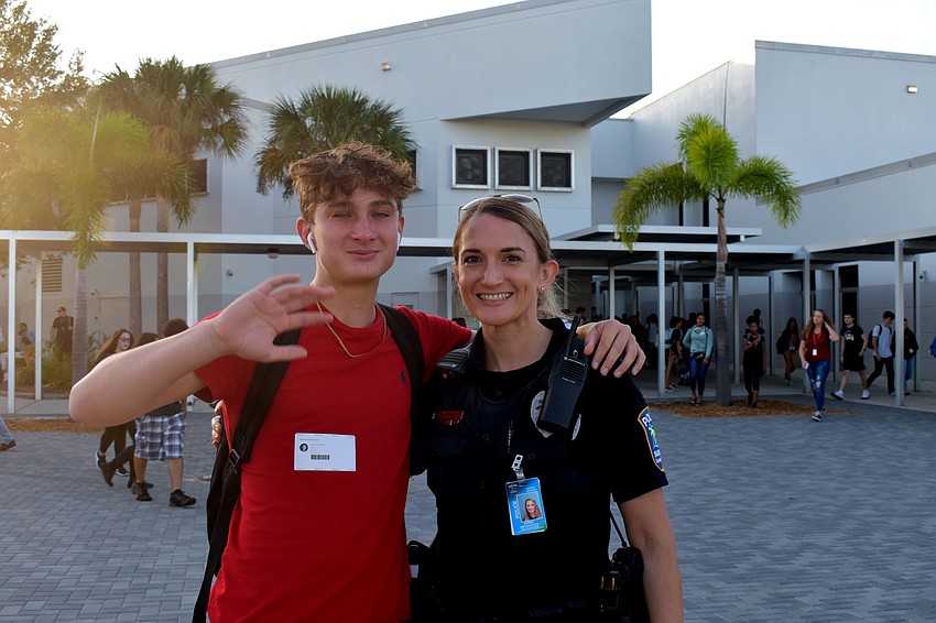 Bron Moncelli poses for a quick photo with Officer Amber DeFrancisco in between classes.
