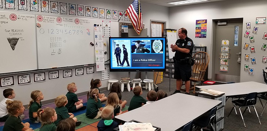 Officer Joe Reed gives a presentation about stranger danger to a group of kindergarten students at Venice Elementary. Photo Courtesy.