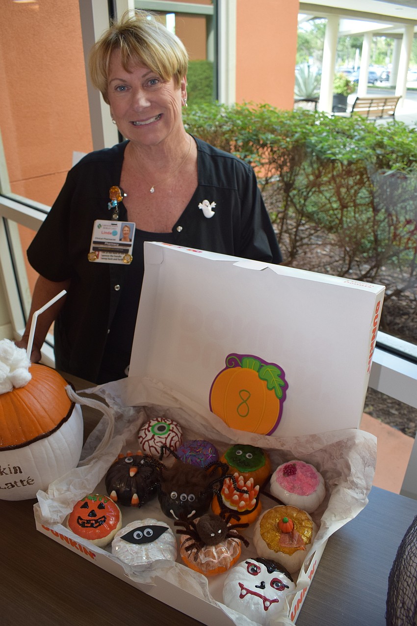 Pharmacist Linda Kokowicz represented the pharmacy department, which created a box of donut-flavored pumpkins. They won the Cutest Pumpkin category.