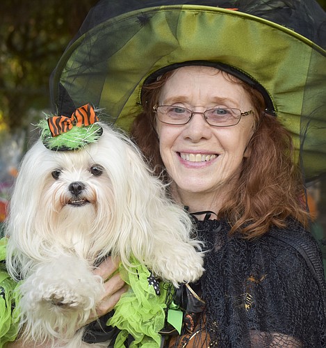 Kathy Trost and her dog Lexi, 2, dress as witches for Arlington Park&#39;s Bark-O-Ween.