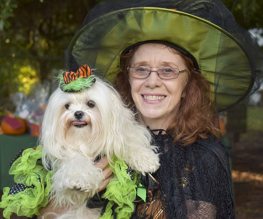 Kathy Trost and Lexi, 2, dress as matching witches.