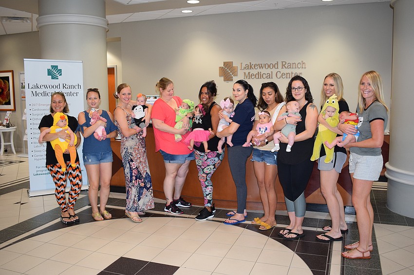 The moms posed for a photo with their babies before starting the baby parade at Lakewood Ranch Medical Center.