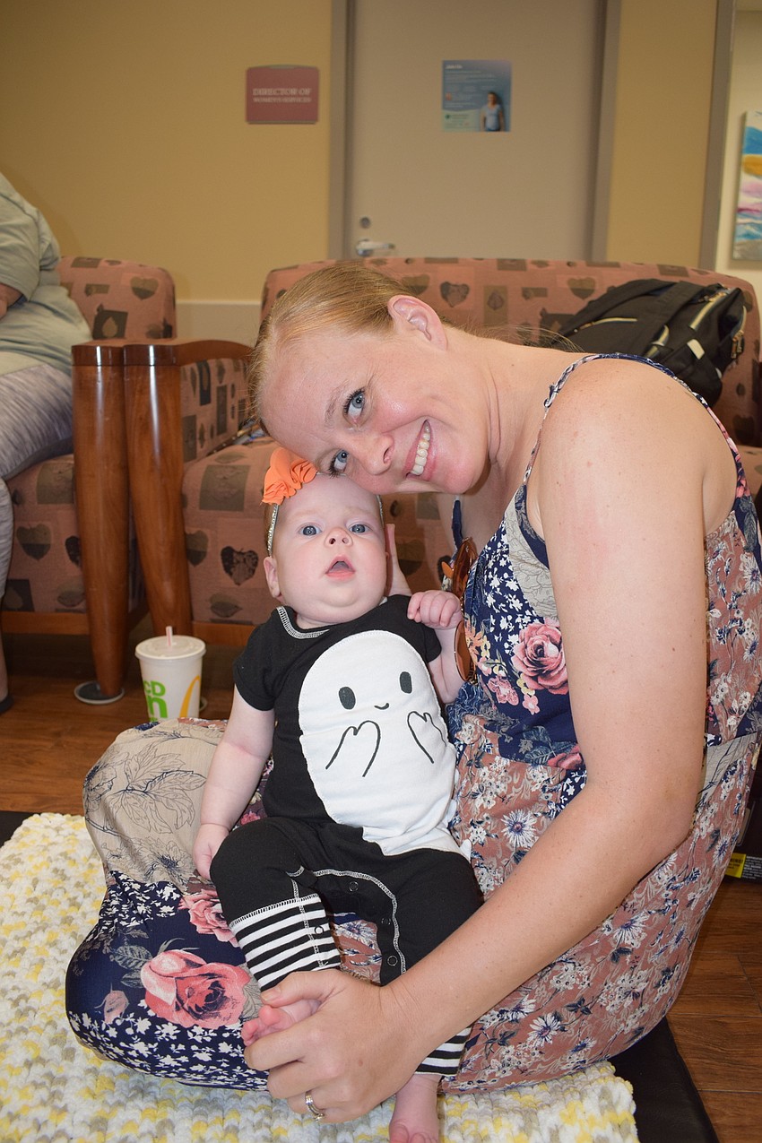 Piper Dolby, who was born July 25 at Lakewood Ranch Medical Center is ready for the parade with mom, Alyssa Dolby.