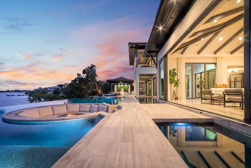 Coverered and open seating areas outdoors expand the options for entertaining. (Photos courtesy: Premier Sotheby’s International Realty)