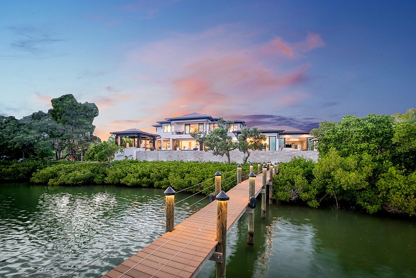 The back yard overlooks Sarasota Bay. (Photos courtesy: Premier Sotheby’s International Realty)
