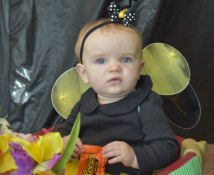 Everette Christy, 1, prepares to snack on a Reese's.