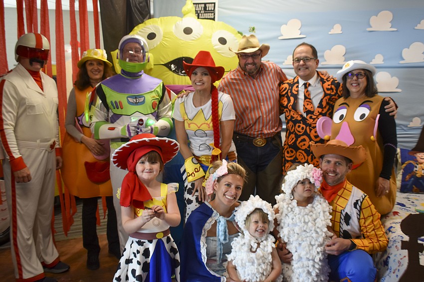 UBS employees and their family members dress as characters from Toy Story.