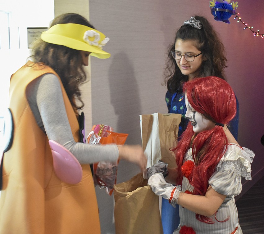 Tylee Giiorgio, 12, dresses as Eleven from Stranger Things and Gina Rose, 11, dresses as IT from IT.