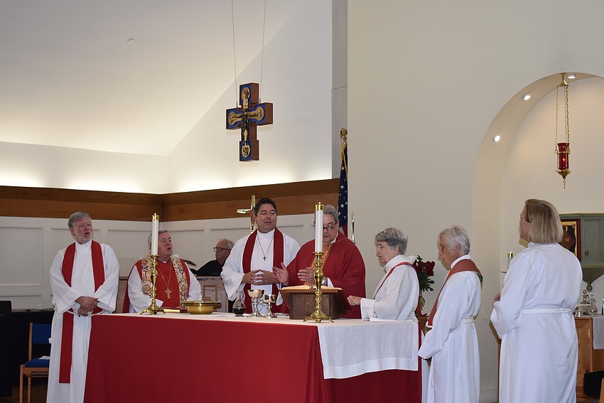 Father Dave Marshall is installed as Rector.