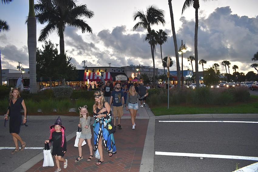 As the sun set, people continued the quest for candy.