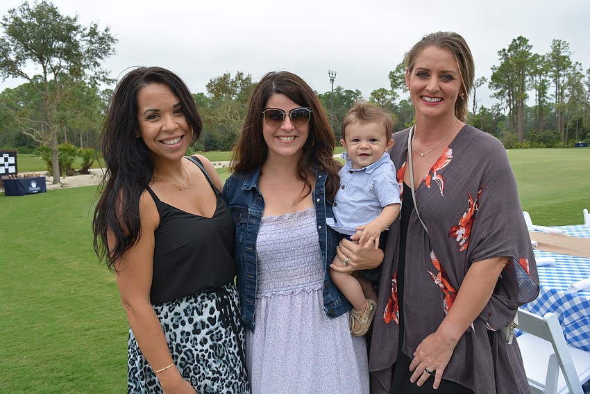 Concession Golf Club members Teresa Pelayo, Julie Lazaris with baby Matthew, and Julia Hendrix say the Gimme will be a great addition for families or golfers wishing for a shorter game.