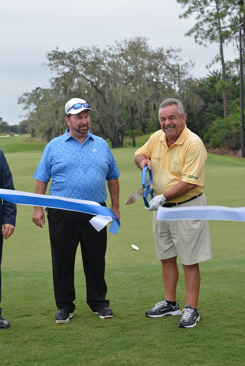 Concession Golf Club owner Bruce Cassidy and legendary British golfer Tony Jacklin cut the ceremonial ribbon for the Gimme course and 