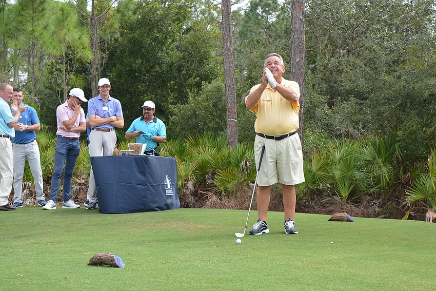 Legendary British golfer Tony Jacklin says a prayer before taking the first shot on the new Gimme course.