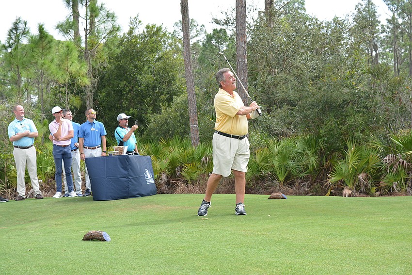 Legendary Tony Jacklin takes the inaugural shot on the Gimme course.