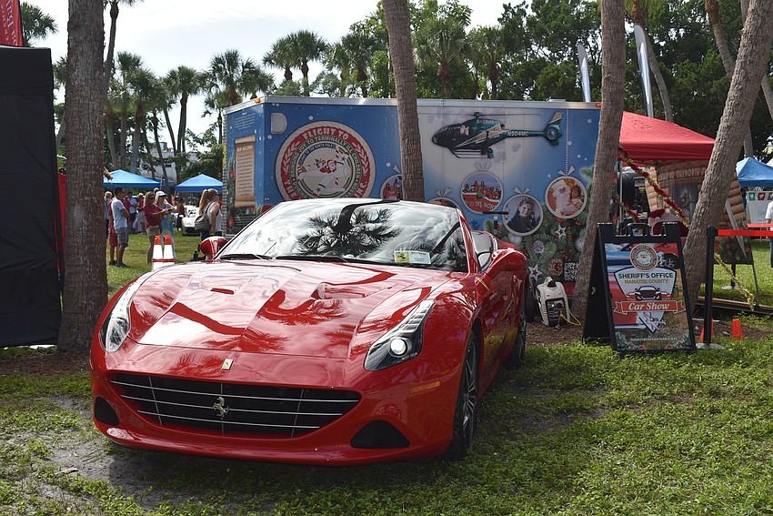 One Ferrari sits next to the trailer for Flight to the North Pole.