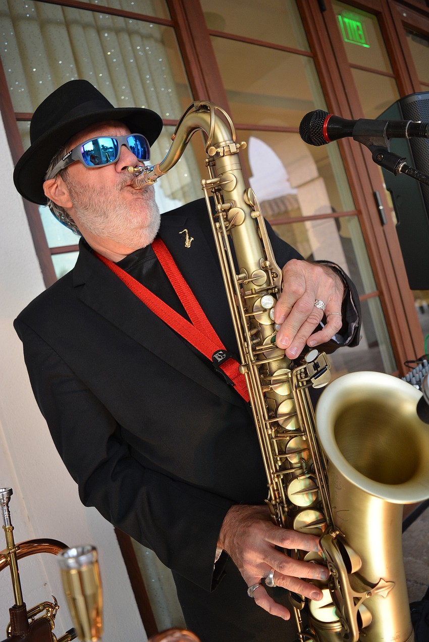 Tommy Butch entertains attendees from the balcony.