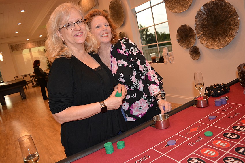 Hope Family Services CFO Char Young and Executive Director Laurel Lynch  check out a roulette table.