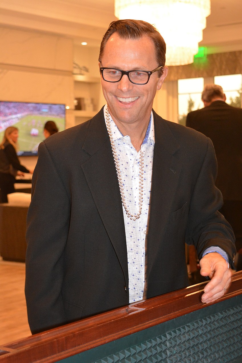 John Cosgrove rolls  a lucky seven during his first game of craps.