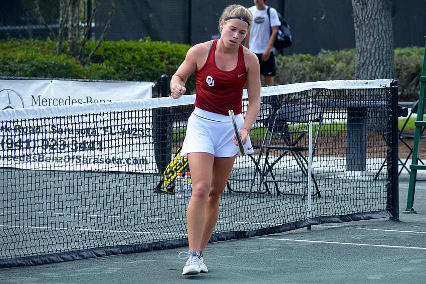 Oklahoma sophomore Marcelina Podlinksa pumps her fist after winning a point against Florida sophomore Marlee Zein.