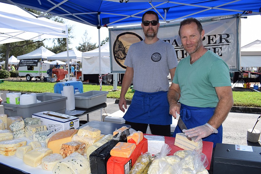 Worker Joe Hanchett and owner Richard Olson were selling Stamper Cheese at the market. Olson said he is confident the Lakewood Ranch market will grow.