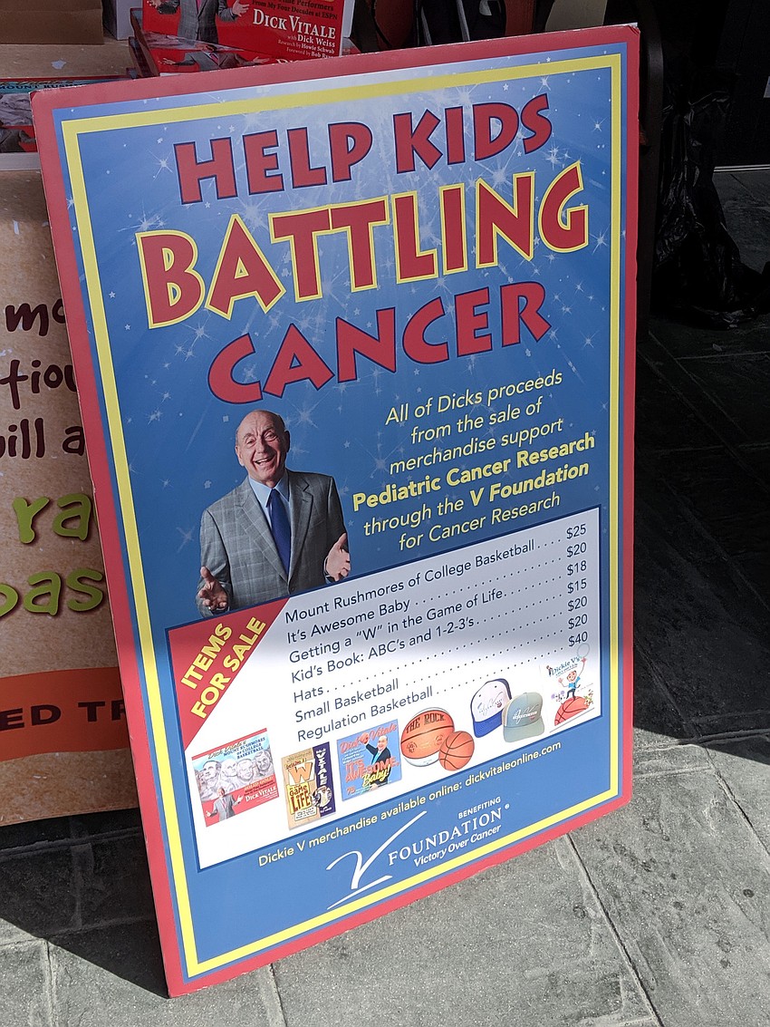 A sampling of things Dick Vitale was selling to raise money for The V Foundation for Cancer Research included copies of his books and signed basketballs.