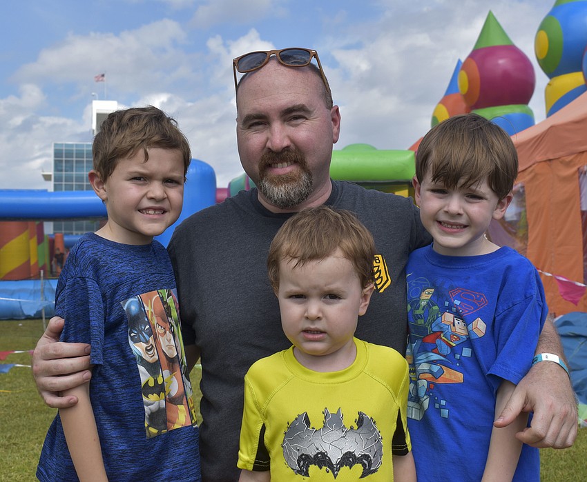 Sean Stewart with his sons Dylan, 8, Logan, 4, and Ryder, 6.