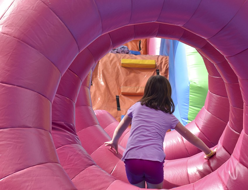 Sydney Matthews, 8, traveks through a circle maze.