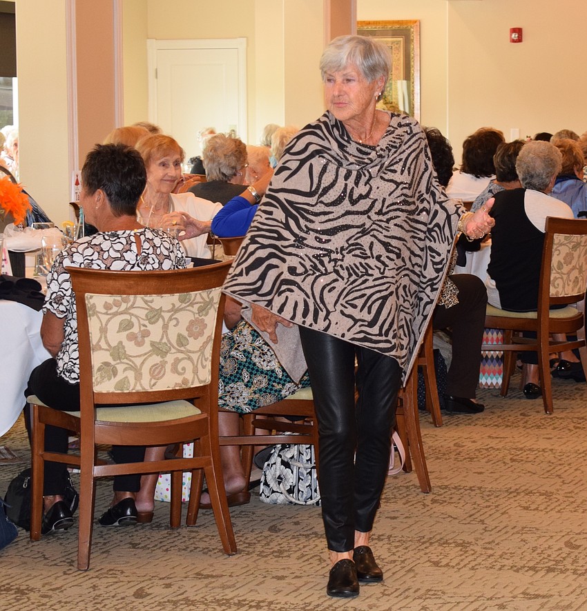 Barbara Lotero poses for a moment for people to see her outfit. Many fashion show guests said the outfit was perfect for Lotero.