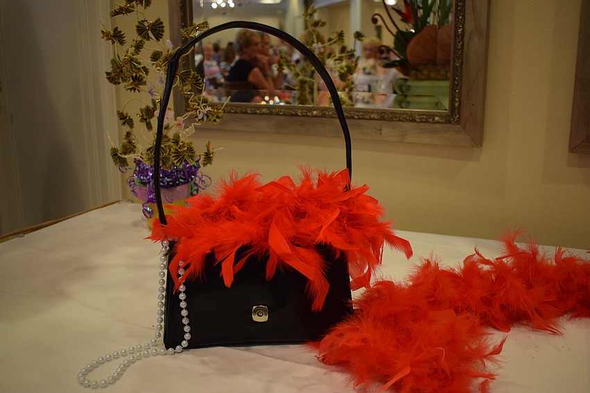 Each table has a decorated purse as a centerpiece. Barbara DiPalma, who is on the social committee that planned the fashion show, said there are different center pieces for each show.