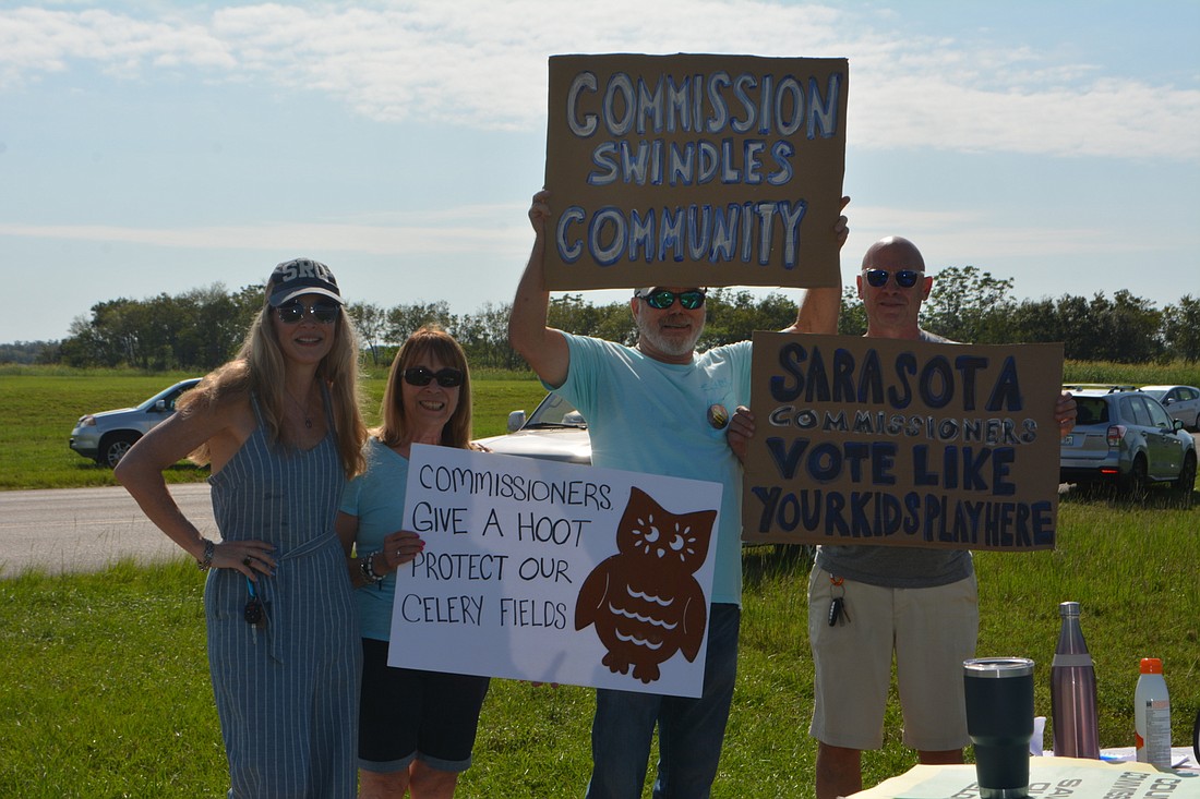  Adrien Lucas, Connie Deramo, Dennis Robertson and Guy DiLullo protest against potential development on the Quads ahead of Wednesday&#39;s Sarasota County Commission meeting, where plans for the land will be discussed.