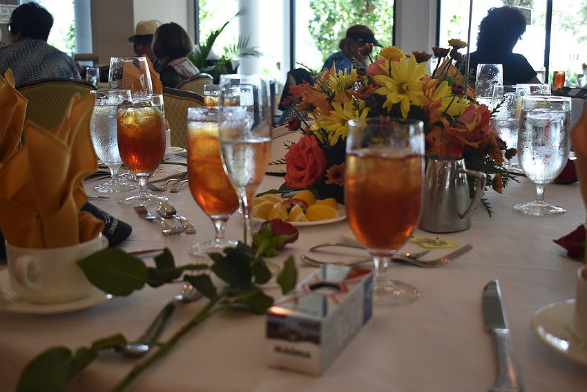 The women were given golf balls at their table spots decorated with fall colors.
