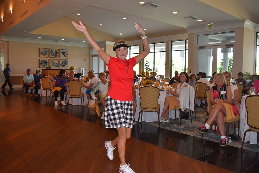 Lynne Koy helps model the new golf collection.