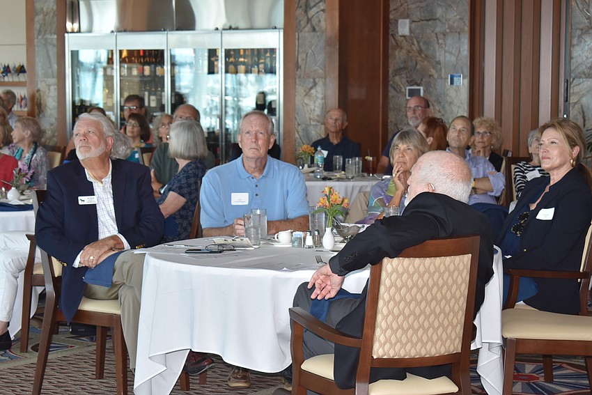 Ken Marsh and Giles VanderBogert listen to Wendell Porter.