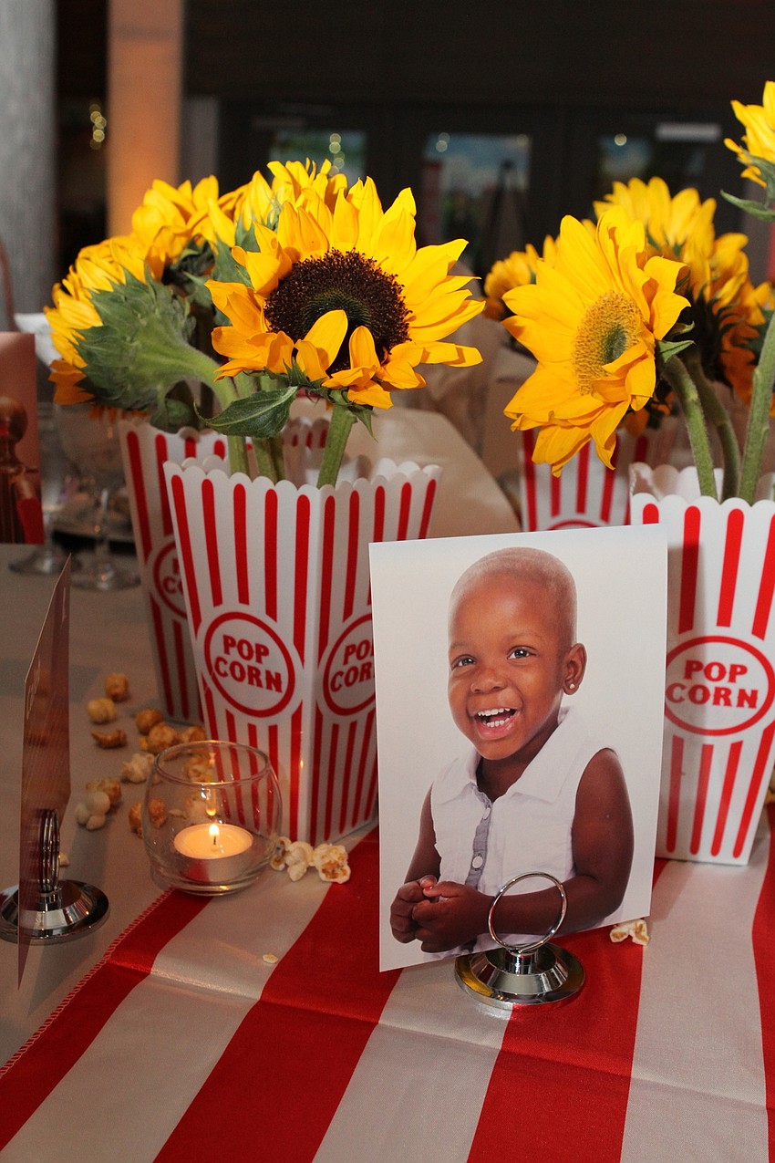Each table had photos of St. Jude patients and popcorn boxes.
